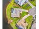 Aerial view of a home with a screened-in pool, backing onto a lake, surrounded by a lush green lawn at 7233 15Th Ne Ct, St Petersburg, FL 33702