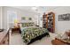 Bright bedroom with neutral colors, ceiling fan and a bookcase full of books at 7233 15Th Ne Ct, St Petersburg, FL 33702
