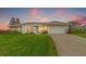 Single Gathering home with an arched doorway, two-car garage, and well maintained lawn at 7233 15Th Ne Ct, St Petersburg, FL 33702