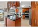 Well-equipped kitchen with stainless steel appliances and plenty of wooden cabinet storage at 7233 15Th Ne Ct, St Petersburg, FL 33702