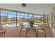 Enclosed pool deck with a view of the lake, heated pool and sitting area at 7233 15Th Ne Ct, St Petersburg, FL 33702