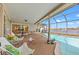 Spacious screened-in pool area with outdoor seating and stunning water views at 7233 15Th Ne Ct, St Petersburg, FL 33702