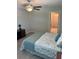 This bedroom features a ceiling fan, carpet flooring, and an open closet to allow for optimal storage at 13621 Willow Bluestar Loop, Riverview, FL 33579