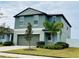 Two story home with a large two car garage and well kept landscaping at 13621 Willow Bluestar Loop, Riverview, FL 33579