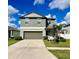 Charming two-story home with a well-manicured lawn, a two-car garage, and pleasant landscaping at 13621 Willow Bluestar Loop, Riverview, FL 33579