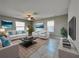 Bright living room featuring modern decor, a plush rug, and comfortable seating arrangements at 13621 Willow Bluestar Loop, Riverview, FL 33579