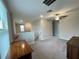 Upstairs landing featuring a desk, a view, and carpeted flooring at 13621 Willow Bluestar Loop, Riverview, FL 33579