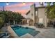 Stunning backyard featuring a sparkling pool, a covered patio, and ample seating for outdoor entertaining at 13945 75Th Ave, Seminole, FL 33776