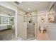 Spacious bathroom with tile flooring, a glass walk-in shower, and updated fixtures at 13945 75Th Ave, Seminole, FL 33776