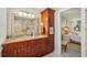 Bright bathroom featuring double sinks, a vanity, and updated fixtures at 13945 75Th Ave, Seminole, FL 33776