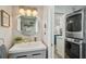 Bathroom with a vanity, view to the laundry room, and neutral tones at 13945 75Th Ave, Seminole, FL 33776