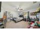 Spacious bedroom with a ceiling fan, large mirror, and plenty of natural light, perfect for relaxing or studying at 13945 75Th Ave, Seminole, FL 33776