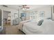 Bright bedroom with neutral walls, ceiling fan, a full dresser and television provides a calming retreat at 13945 75Th Ave, Seminole, FL 33776