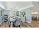 Dining room featuring a light blue interior and a dark wood table with seating for eight at 13945 75Th Ave, Seminole, FL 33776