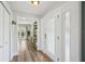 Foyer with light wood flooring, a glass front door, and hallway views at 13945 75Th Ave, Seminole, FL 33776