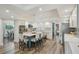 Bright kitchen features white cabinets, stainless steel appliances and a large center island with seating at 13945 75Th Ave, Seminole, FL 33776