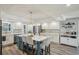 Spacious kitchen features a center island with seating, stainless steel appliances, and ample counter space at 13945 75Th Ave, Seminole, FL 33776