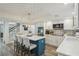 Bright kitchen with a center island, stainless steel appliances, and eye-catching backsplash tiles at 13945 75Th Ave, Seminole, FL 33776