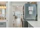 Laundry area with stackable washer and dryer with hallway views to living space at 13945 75Th Ave, Seminole, FL 33776
