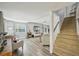 Living room view features wood floors, recessed lights, comfortable seating, and staircase at 13945 75Th Ave, Seminole, FL 33776