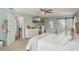 Bright and spacious main bedroom with a connecting bathroom, featuring plush carpeting and plenty of natural light at 13945 75Th Ave, Seminole, FL 33776