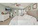Bright and spacious main bedroom with a connecting bathroom, featuring plush carpeting and plenty of natural light at 13945 75Th Ave, Seminole, FL 33776