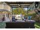 Backyard view featuring a swimming pool and covered outdoor seating area at 13945 75Th Ave, Seminole, FL 33776
