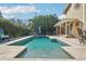 Sparkling backyard pool with a spacious deck, lush landscaping, and comfortable seating for outdoor relaxation at 13945 75Th Ave, Seminole, FL 33776