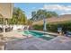 Beautiful backyard pool area with patio, lounge chairs, and lush landscaping, ideal for outdoor entertaining at 13945 75Th Ave, Seminole, FL 33776