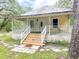 Charming bungalow with a welcoming front porch and well-maintained yard at 262 Pryor St, Brooksville, FL 34601