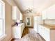 Traditional kitchen with white cabinets, bright natural light and matching appliances at 262 Pryor St, Brooksville, FL 34601