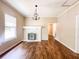Cozy living room with a fireplace and hardwood flooring at 262 Pryor St, Brooksville, FL 34601