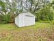 Outdoor shed with a garage door to hold all your extra supplies at 262 Pryor St, Brooksville, FL 34601