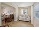 Bright and airy living room showcasing neutral decor, and view to a comfortable sitting area at 3340 Mcmath Dr, Palm Harbor, FL 34684