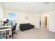 Bright room with a desk and a futon at 38311 Sonnet Landing Ave, Zephyrhills, FL 33540