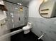 Modern bathroom featuring a glass-enclosed shower and marble-look tile at 5321 Dover Ne St, St Petersburg, FL 33703