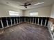 Spacious bedroom with wood-look tile flooring and a ceiling fan at 5321 Dover Ne St, St Petersburg, FL 33703
