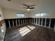 Bright bedroom with windows, wood-look floors, and modern ceiling fan awaits your personal touches at 5321 Dover Ne St, St Petersburg, FL 33703