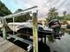 Boat lift featuring a Yamaha engine with view of the harbor at 5321 Dover Ne St, St Petersburg, FL 33703