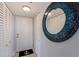 Cozy entryway featuring a decorative mirror and closet storage for a welcoming space at 6104 Palma Del Mar S Blvd # 404, St Petersburg, FL 33715