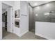 Modern bathroom with a glass-enclosed shower and convenient access to a walk-in closet at 2246 Fiesta Dr, Sarasota, FL 34231