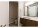 Modern half bathroom with single sink, sleek vanity, and neutral decor at 2246 Fiesta Dr, Sarasota, FL 34231