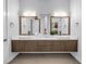 Modern bathroom featuring double vanities, quartz countertops, and sleek fixtures at 2246 Fiesta Dr, Sarasota, FL 34231