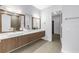 Modern bathroom featuring double vanities, quartz countertops, and sleek fixtures at 2246 Fiesta Dr, Sarasota, FL 34231