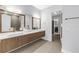 Modern bathroom featuring double vanities, quartz countertops, and sleek fixtures at 2246 Fiesta Dr, Sarasota, FL 34231
