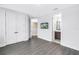 Bedroom featuring a large closet, ensuite bathroom, and gray wood-look flooring at 2246 Fiesta Dr, Sarasota, FL 34231