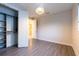 Bright bedroom features stylish gray wood-look floors and a modern light fixture at 2246 Fiesta Dr, Sarasota, FL 34231