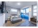 Inviting bedroom with sliding glass doors to covered deck at 2246 Fiesta Dr, Sarasota, FL 34231