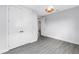 This bedroom includes wood-look flooring, large closet, and modern pendant light at 2246 Fiesta Dr, Sarasota, FL 34231