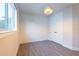 Bright bedroom with textured wall, wood-look floors and modern light fixture at 2246 Fiesta Dr, Sarasota, FL 34231
